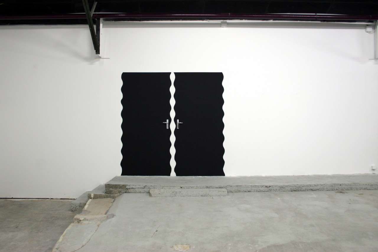 Two black doors with vague outlines