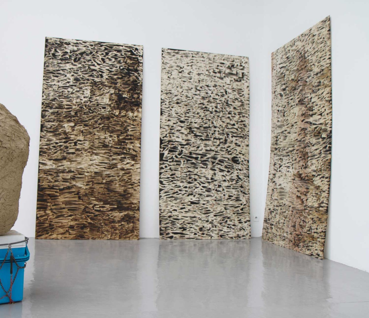 Stretched out from three wooden boards on the wall