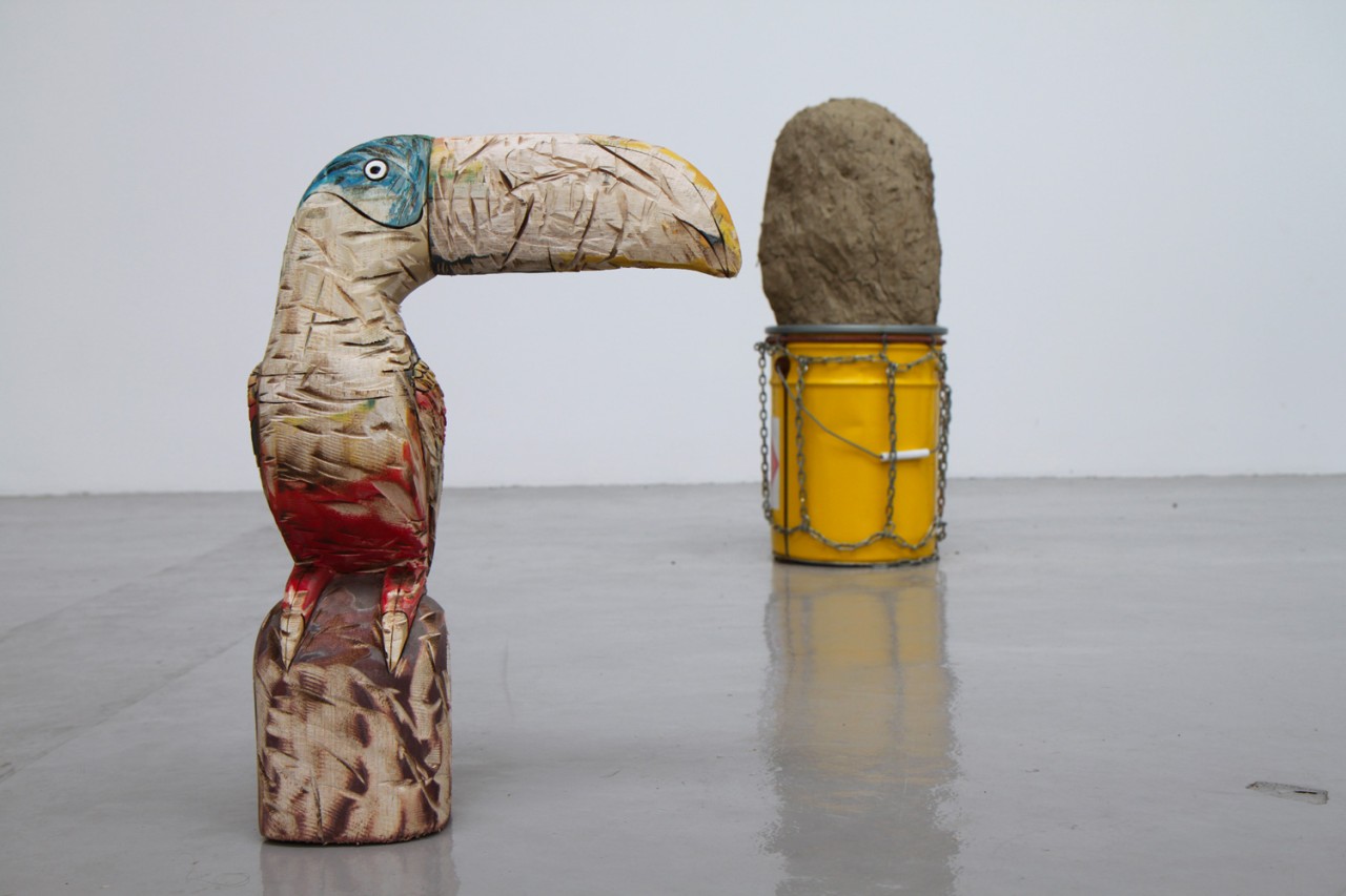 Found object in the shape of a parrot made of worn wood